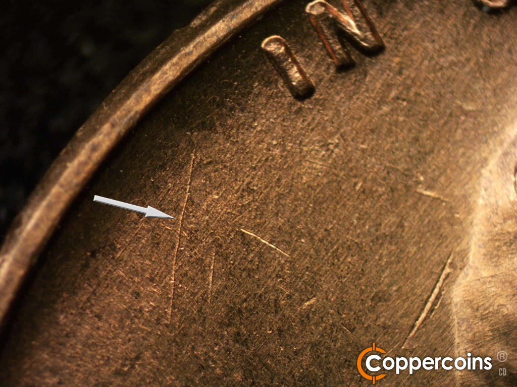 Die-stage A marker on 1950D•1MM•011 showing Unique die scratch in field under IN.