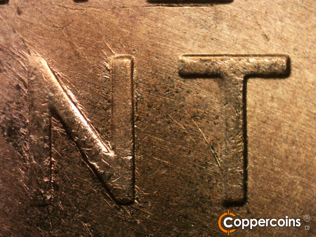 Die-stage A marker on 1950D•1MM•011 showing NW die scratches from N in CENT.