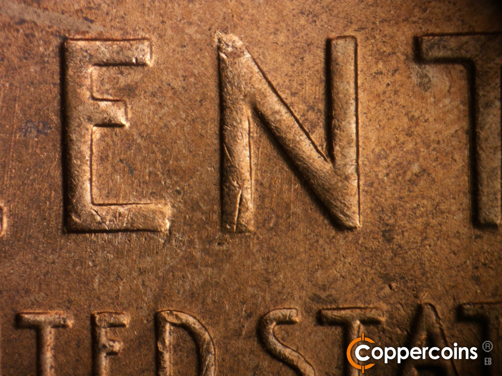 Die-stage B marker on 1950D•1MM•038 showing Light die scratches through N in CENT.