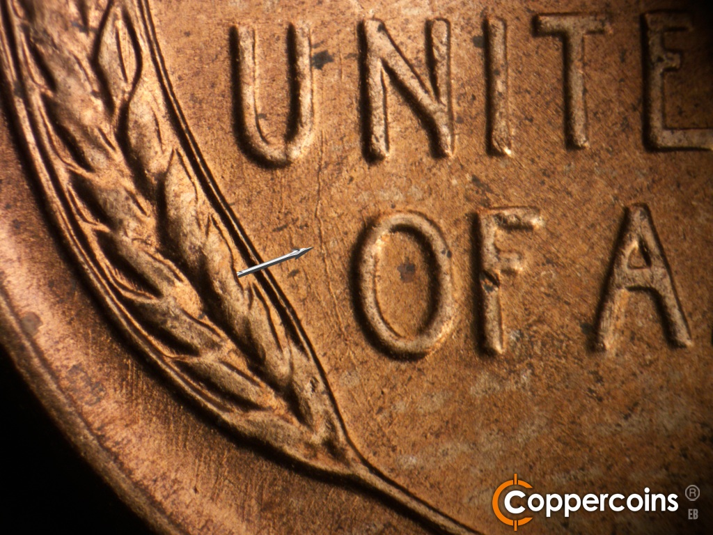 Die-stage B marker on 1950D•1MM•038 showing Unique die scratch from U in UNITED running between O in OF and left wheat.