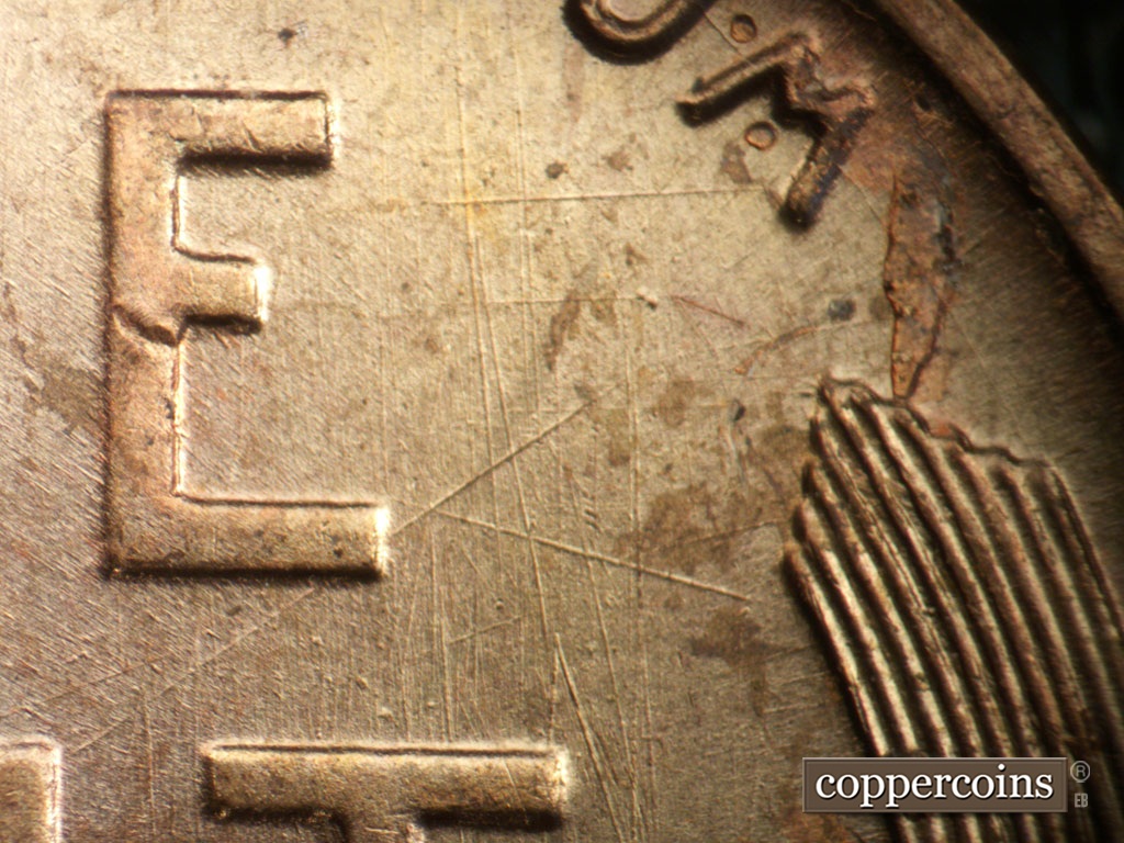 Die-stage A marker on 1950P•1DO•005 showing Heavy die scratches east of E in ONE.