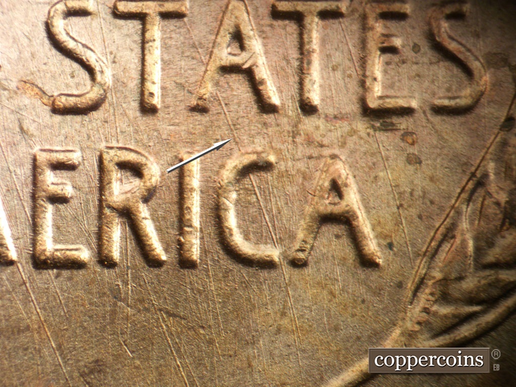 Die-stage A marker on 1950P•1DO•005 showing Heavy SE die scratch through A in STATES down through C in AMERICA.