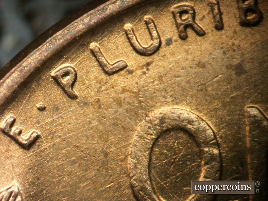 Die-stage A marker on 1950P•1DR•002 showing Doubling shows on PLURIBUS. NE die scratches throughout field under and through PLURIBUS.