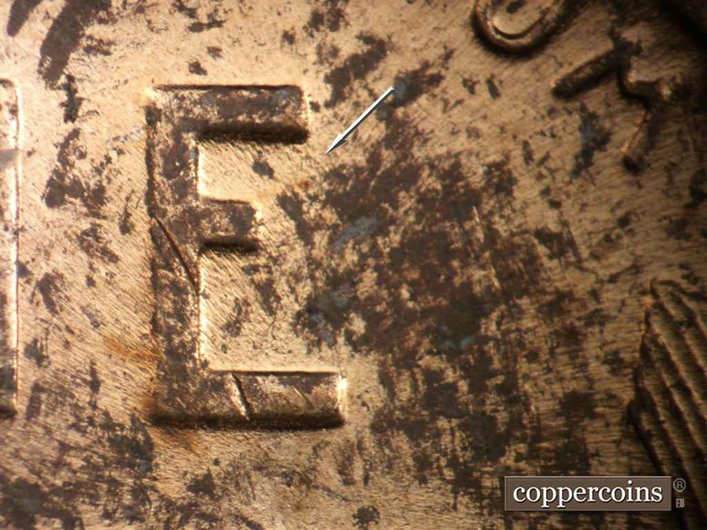 Die-stage C marker on 1951D•1MM•071 showing SE die scratch or wear from top of E in ONE.