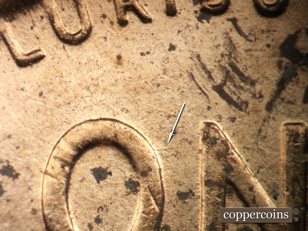 Die-stage C marker on 1951D•1MM•071 showing E/W die scratch from O in ONE.