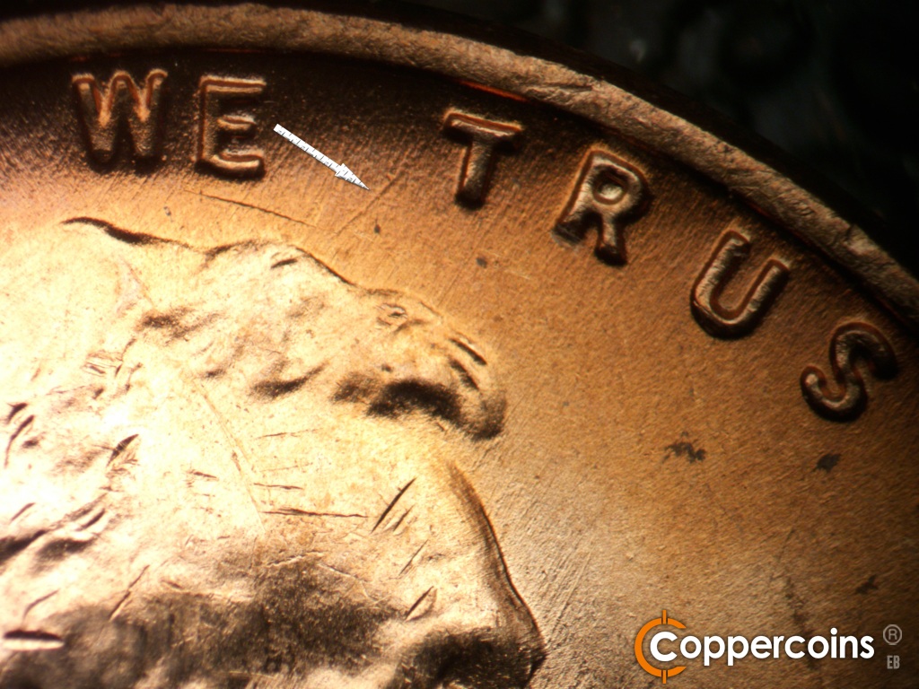 Die-stage B marker on 1951D•1MM•072 showing Curved die scratch from top of head toward top of first T in TRUST.