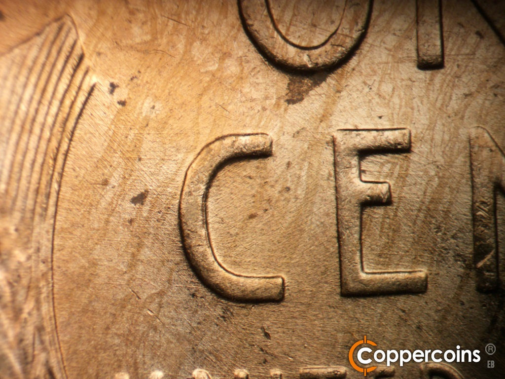 Die-stage B marker on 1951D•1MM•072 showing Multidirectional die scratches between left wheat stalk and C in CENT.