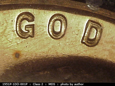 Die-stage B marker on 1951P•1DO•001P showing Heavy doubling shows on the word God.