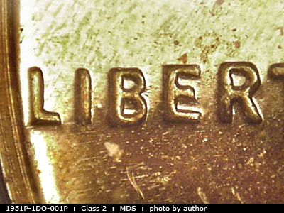 Die-stage B marker on 1951P•1DO•001P showing A heavy die dot shows between the center of the I and the B of Liberty.