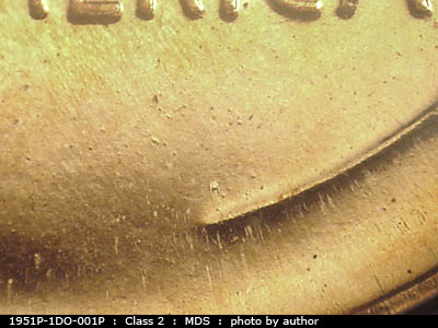 Die-stage B marker on 1951P•1DO•001P showing Many die dots show near the lower right wheat stem.