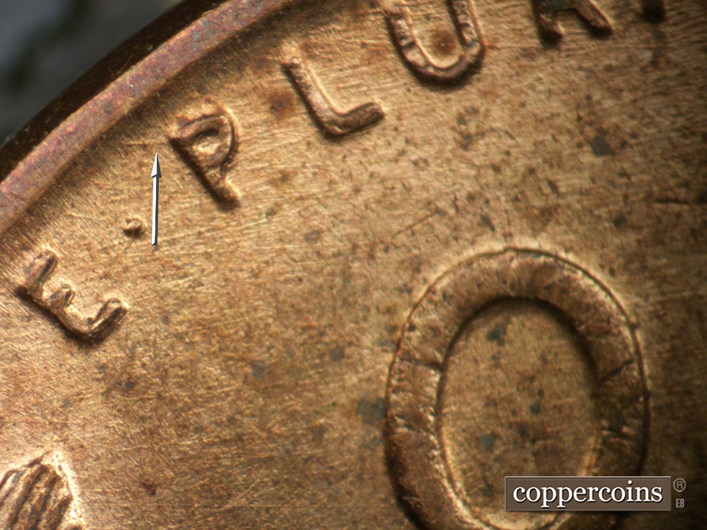 Die-stage A marker on 1951P•1DO•003 showing Die scratches through E PLURIBUS.