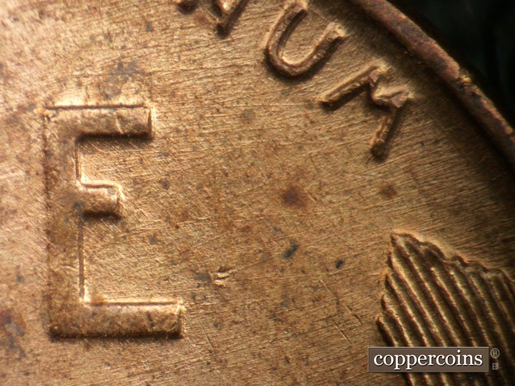 Die-stage A marker on 1951P•1DO•003 showing E/W die scratches from E in ONE.