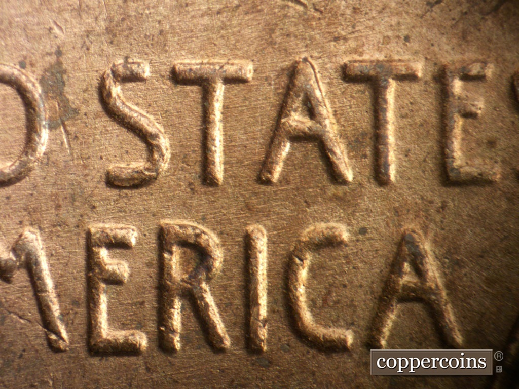 Die-stage A marker on 1951P•1DO•003 showing E/W die scratches through STATES and AMERICA.