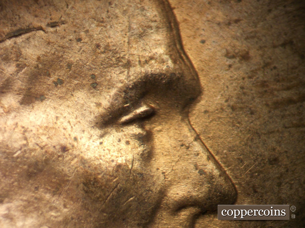 Die-stage B marker on 1952D•1DO•010 showing Extra upper eyelid south of primary.