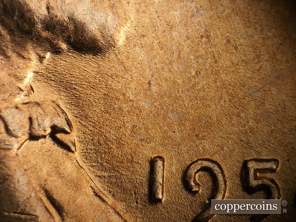 Die-stage A marker on 1952D•1MM•002 showing Die scratches near throat.