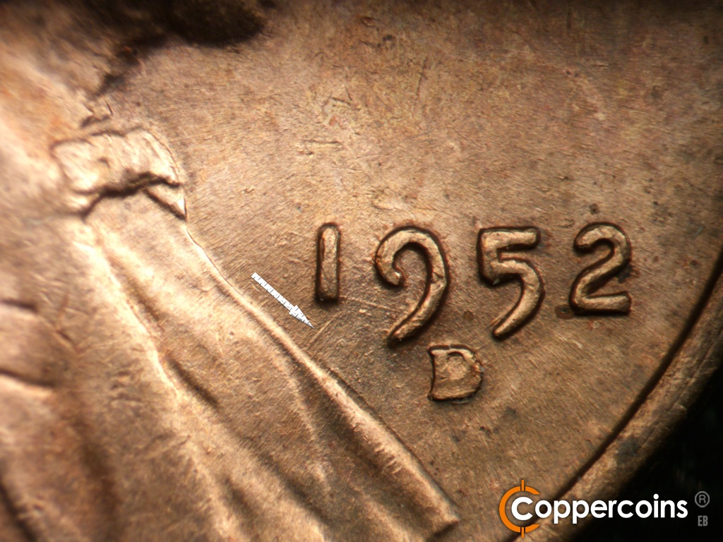 Die-stage C marker on 1952D•1MM•018 showing NE die scratch from lapel to bottom of 1 in date.