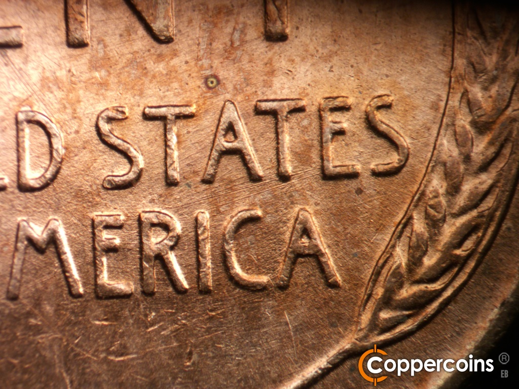 Die-stage C marker on 1952D•1MM•018 showing ENE die scratches through STATES and AMERICA.