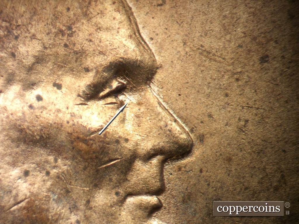 Die-stage B marker on 1952D•1MM•035 showing SE die scrates seen through eye.