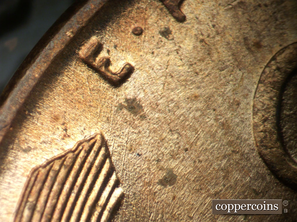 Die-stage B marker on 1952D•1MM•035 showing NNE die scratches from left wheat tip toward E in E PLURIBUS.
