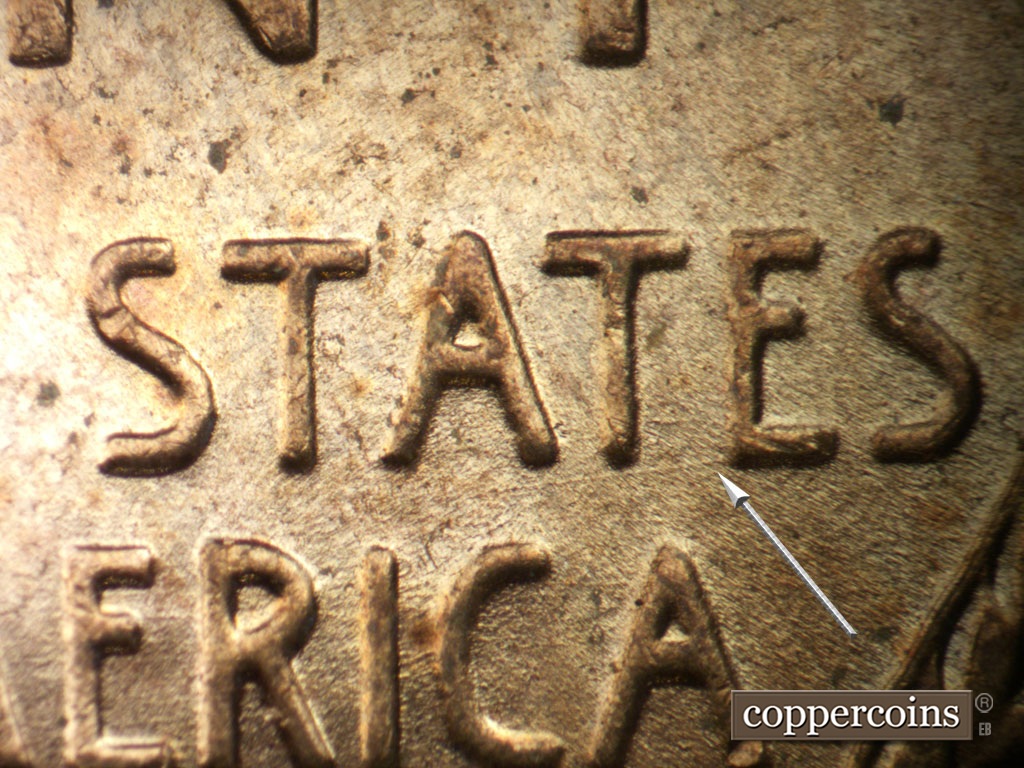 Die-stage B marker on 1952D•1MM•035 showing Die scratches heads wsw from E in STATES.