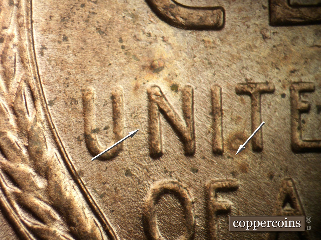 Die-stage B marker on 1952D•1MM•035 showing Light NW die scratch from N in UNITED. SE die scratch from I in UNITED.