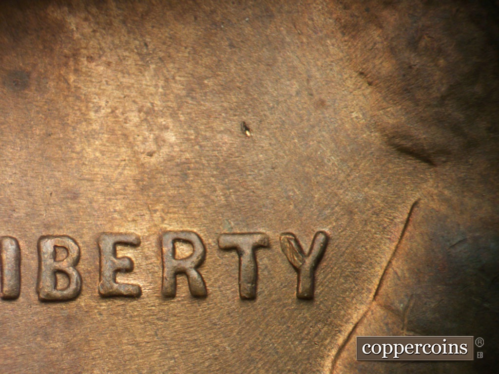 Die-stage C marker on 1952D•1MM•061 showing Worn SE die scratches througy TY in :LIBERTY.