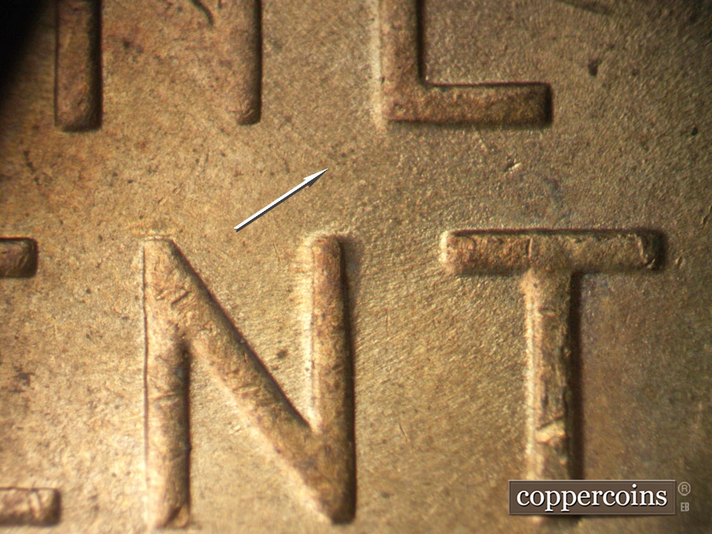 Die-stage C marker on 1952D•1MM•061 showing SE die scratch connect N in ONE to T in CENT.