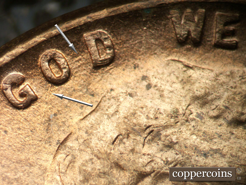 Die-stage C marker on 1952D•1MM•088 showing SSW die scratch from O in GOD. Worn concentric die scratches through GOD.