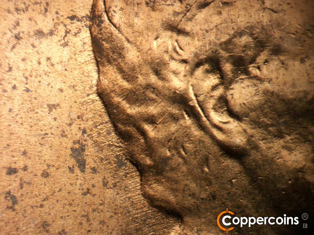 Die-stage B marker on 1952D•1MM•088 showing Die scratches from back of hair.