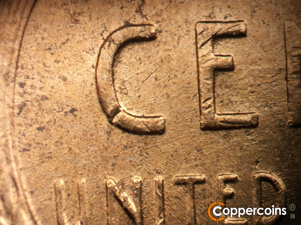 Die-stage B marker on 1952D•1MM•088 showing E/W die scratch connects E to N in CENT. Worn die scratches through CENT.