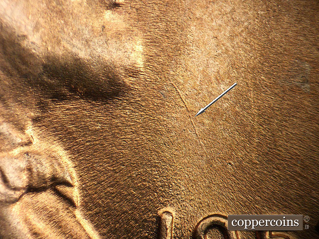 Die-stage B marker on 1952D•1MM•092 showing SE die scratch in field between beard and date.