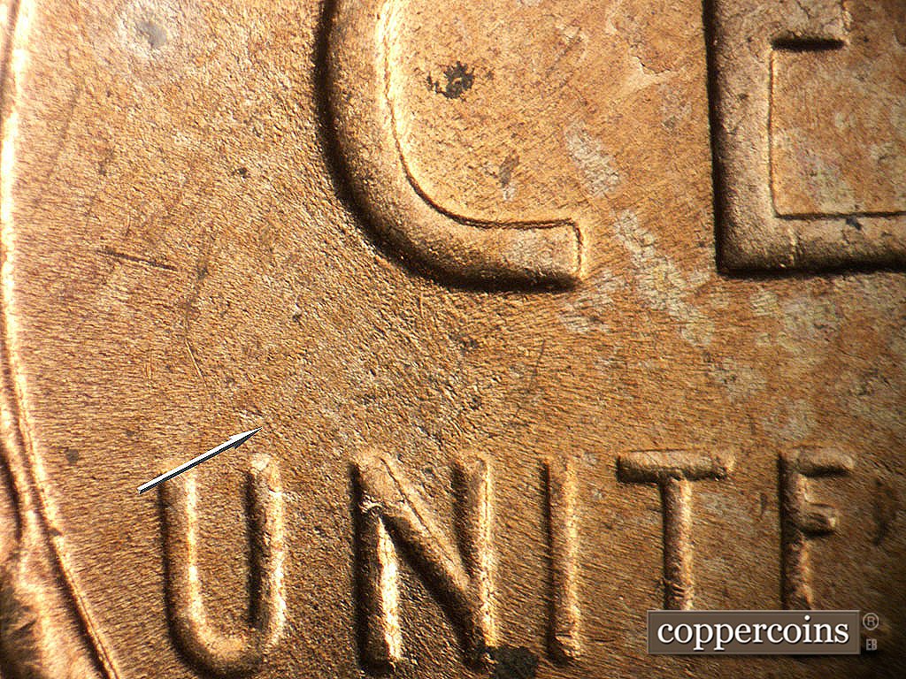 Die-stage B marker on 1952D•1MM•092 showing SE die scratch above U in UNITED.