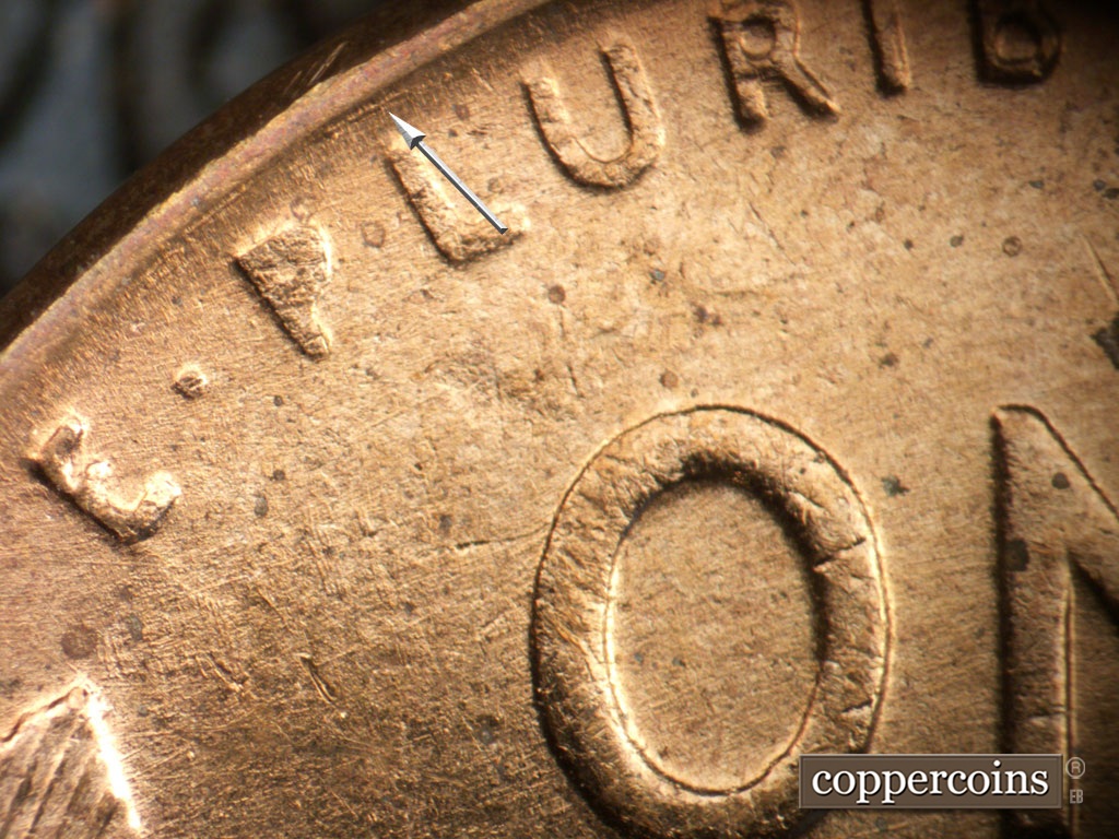 Die-stage A marker on 1952D•1MM•093 showing Concentric die scratch between rim and PLURIBUS.