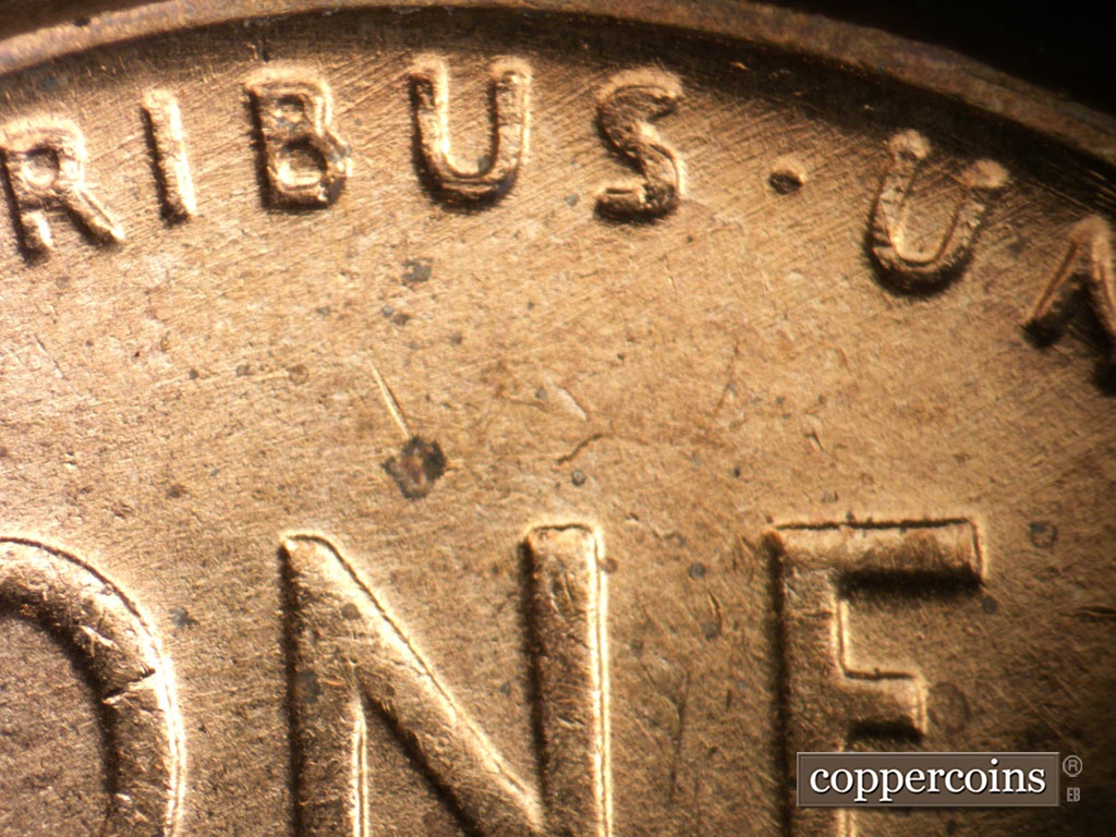 Die-stage A marker on 1952D•1MM•093 showing NE die scratches through RIBUS in PLURIBUS.