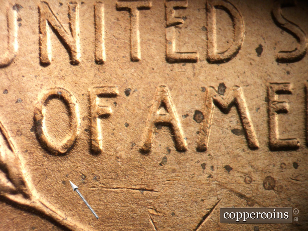 Die-stage A marker on 1952D•1MM•093 showing NE die scratch from left wheat to first A in AMERICA.