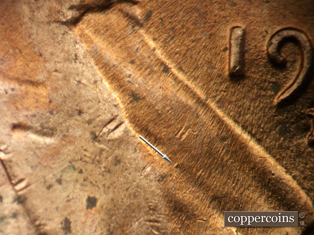 Die-stage B marker on 1952D•1MM•094 showing Die dot on lapel.