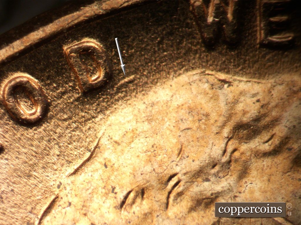 Die-stage B marker on 1952D•1MM•094 showing Die gouge near D in GOD,.