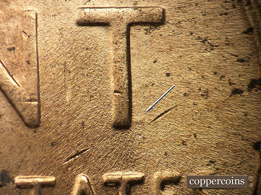 Die-stage C marker on 1952D•1MM•097 showing Die depression near bottom of T in CENT.