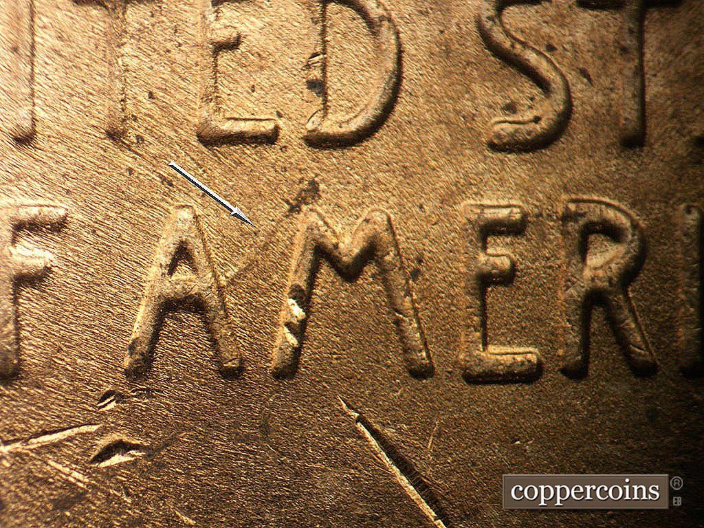 Die-stage C marker on 1952D•1MM•097 showing Die gouge from first A in AMERICA.