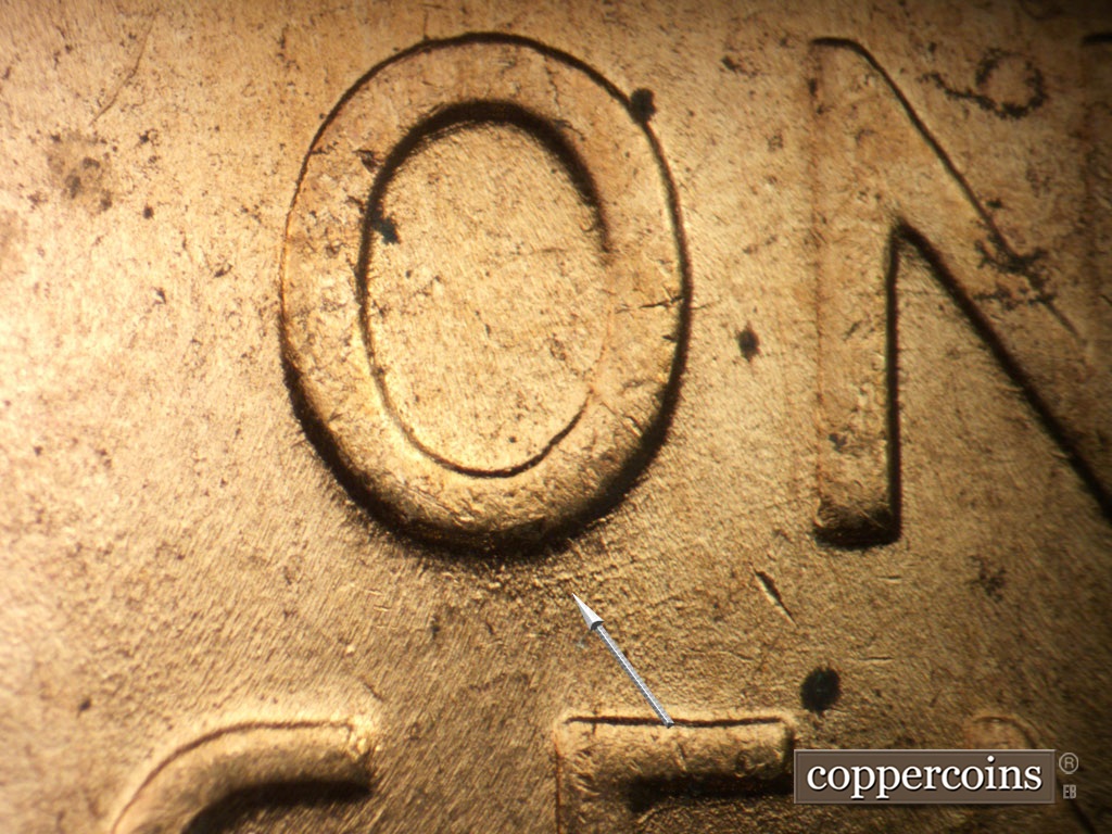 Die-stage B marker on 1952D•1MM•098 showing Worn ENE die scratch under O in ONE.