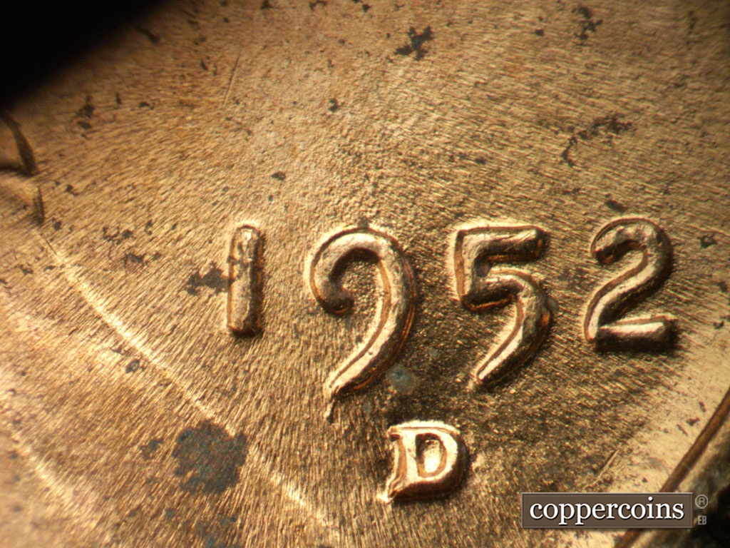 Die-stage C marker on 1952D•1MM•099 showing Die crack from bottom of 9 in date.