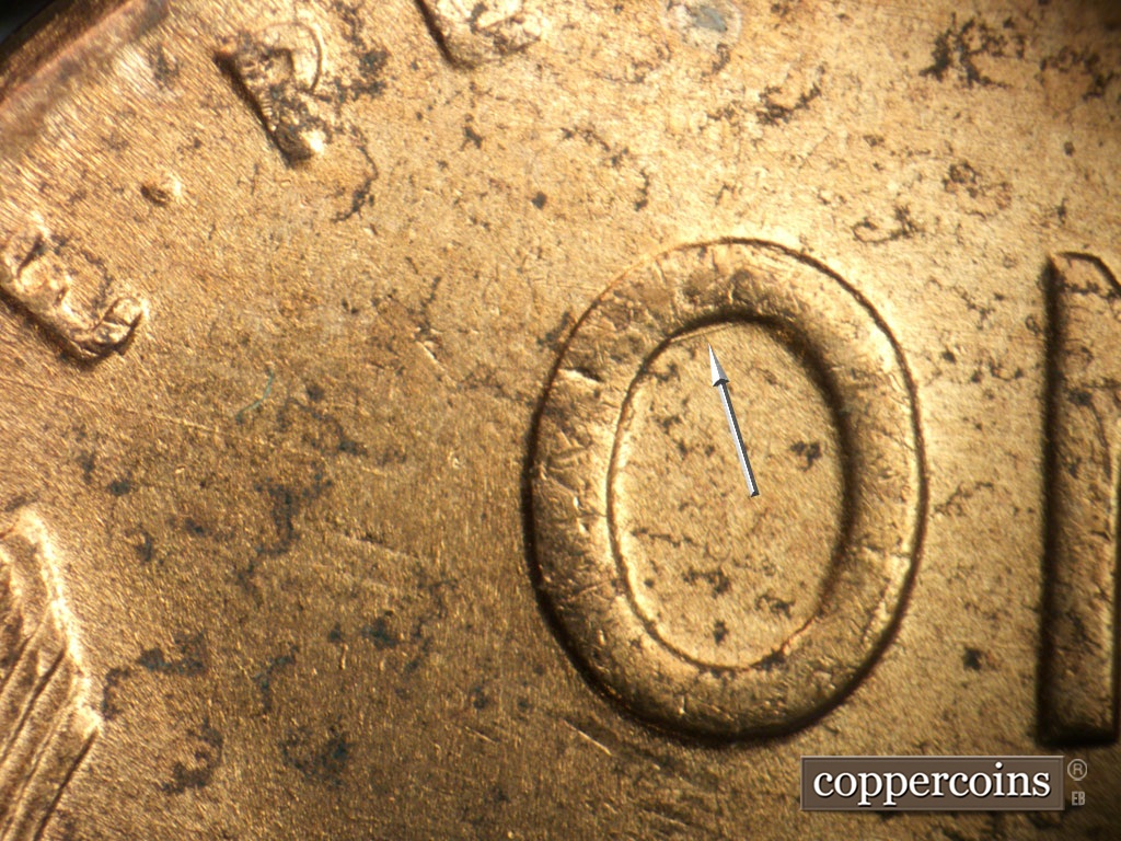 Die-stage B marker on 1952D•1MM•100 showing ENE die scratch in O of ONE.
