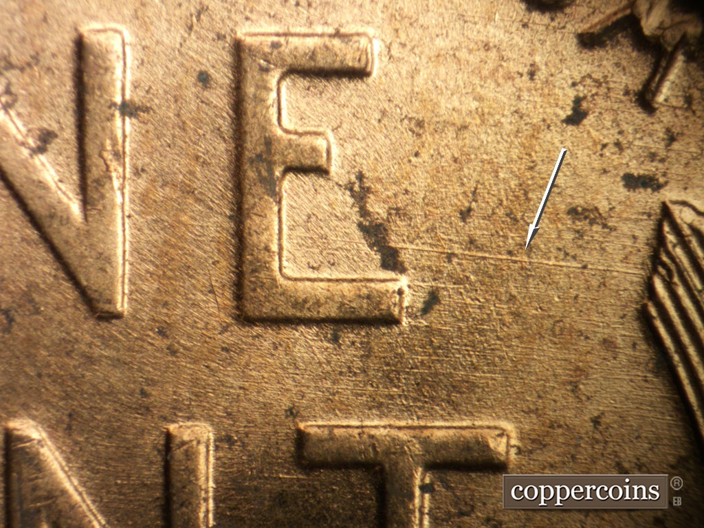 Die-stage B marker on 1952D•1MM•100 showing E/W die scratch from lower E in ONE to right wheat stalk tip.
