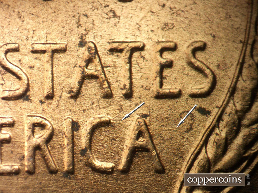 Die-stage B marker on 1952D•1MM•100 showing ESE die scratch through CA in AMERICA.