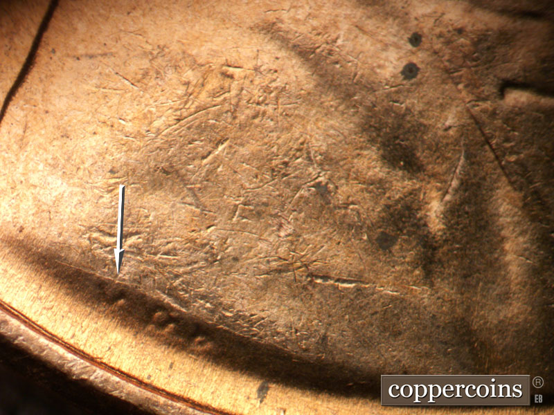 Die-stage B marker on 1953D•1DO•007 (1953 Doubled Die Obverse).