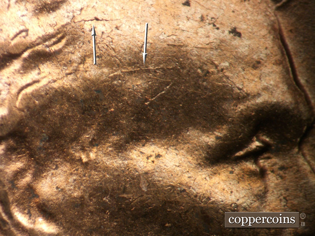 Die-stage B marker on 1953D•1DO•009 showing Die cracks on forehead.
