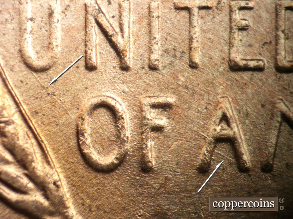 Die-stage B marker on 1953D•1DO•009 showing SE die scratch connect U in UNITED to O in OF. SE die scratch in lower first A in AMERICA.