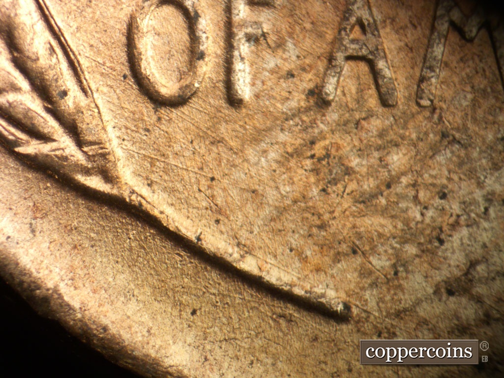 Die-stage A marker on 1953D•1MM•026 showing SE dioe scratches connect the left wheat stalk to O in OF.