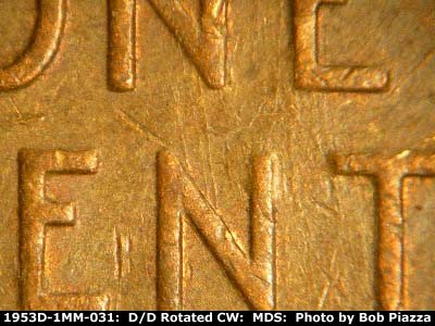 Die-stage C marker on 1953D•1MM•031 showing Generally N/S die scratches connec N in ONE to N in CENT.