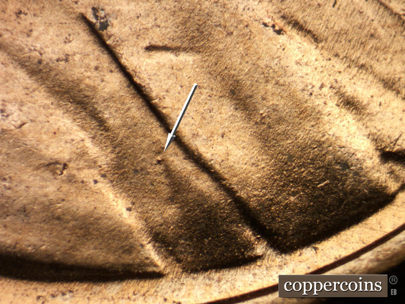 Die-stage C marker on 1953D•1MM•053 showing Die dot on jacket.